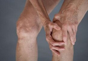 Self -massage knees with arthrosis